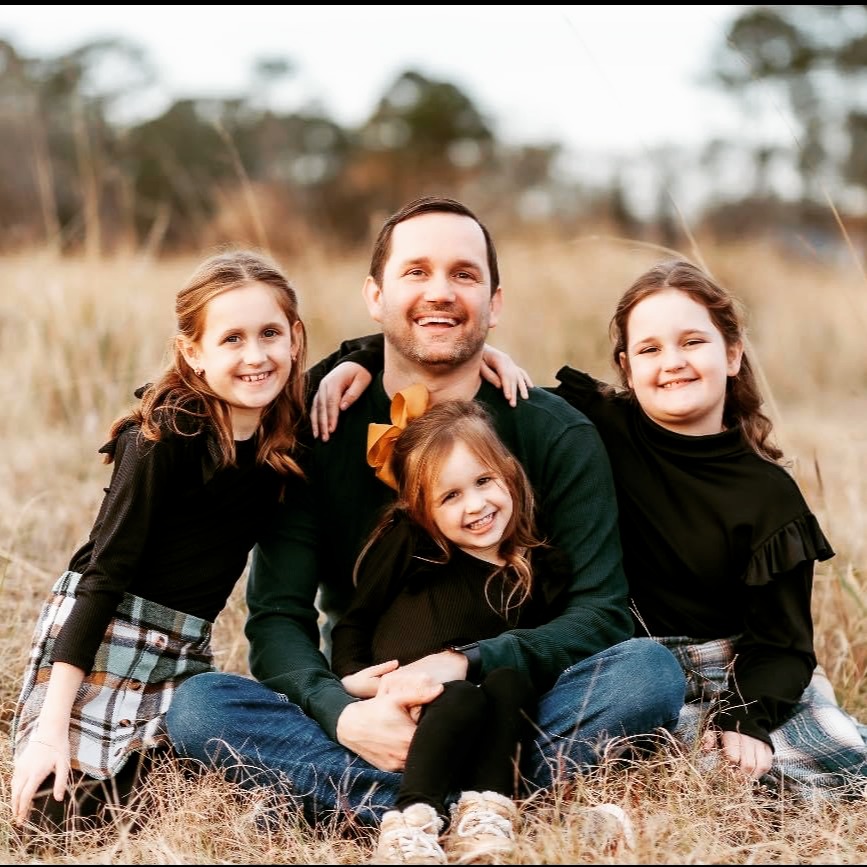 Jerrod Ball with his three daughters
